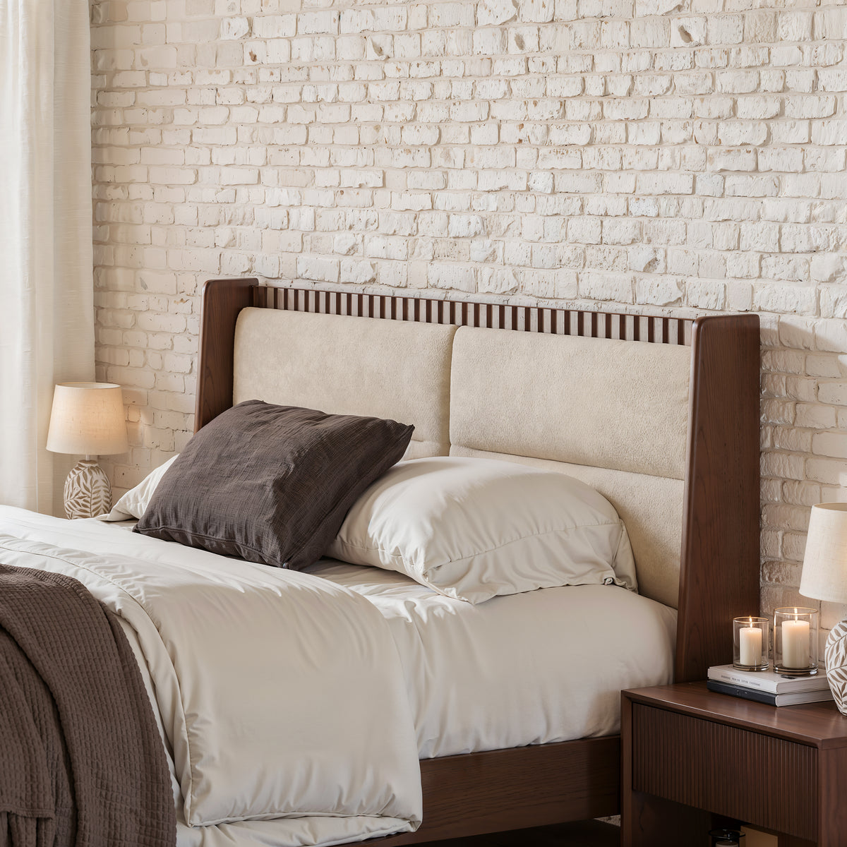 Close-up of fluted headboard and boucle cushions