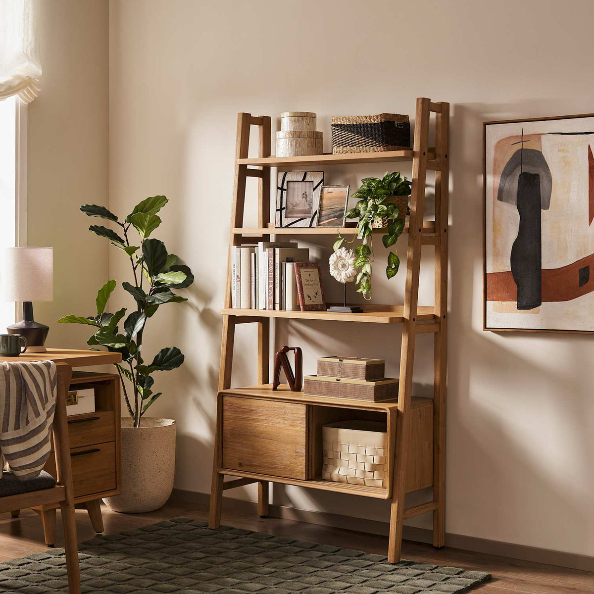 Seb acacia ladder bookshelf styled with books and plants