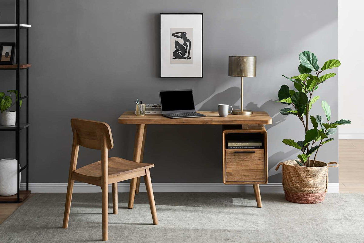 Seb desk styled with a lamp and laptop