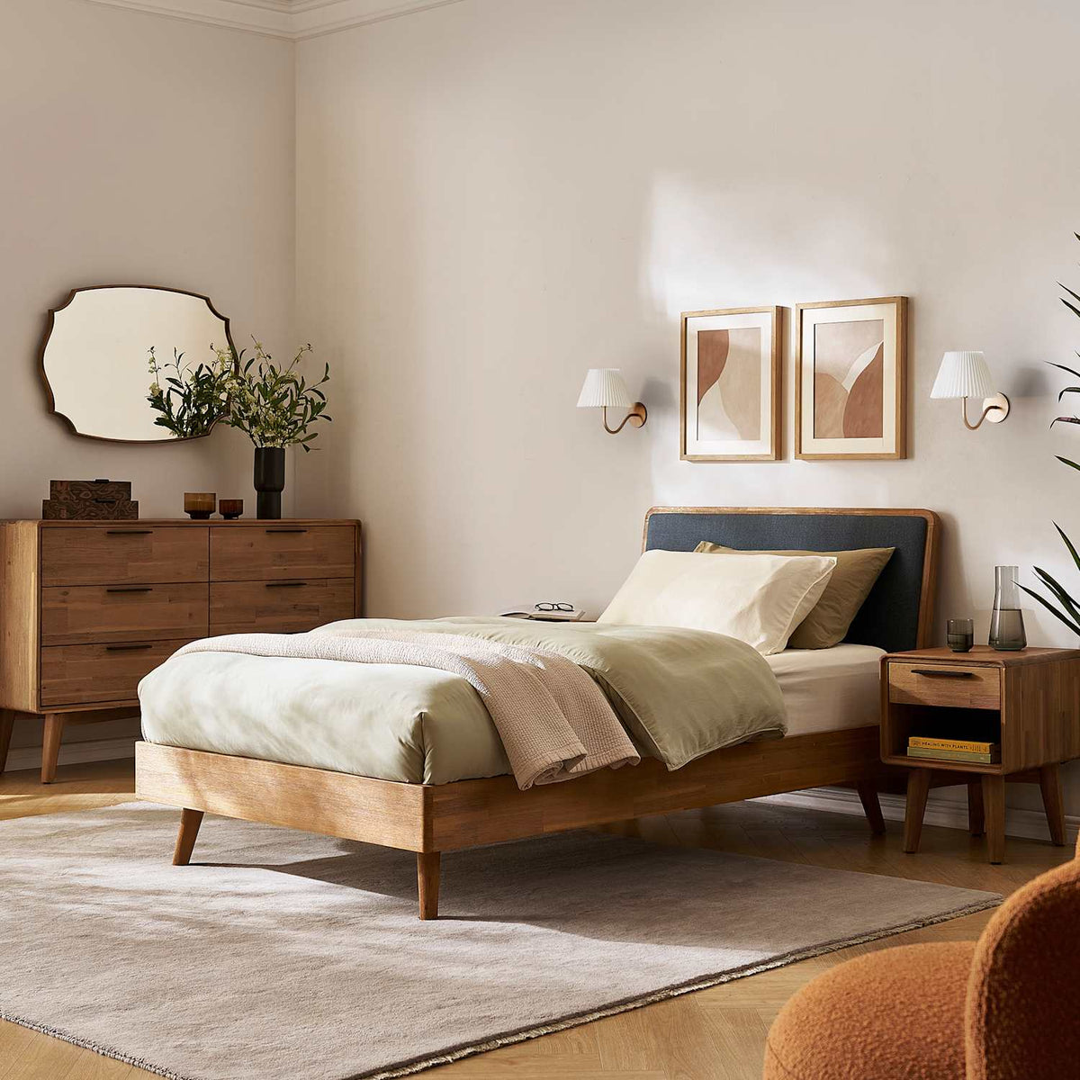 Seb acacia wood bed with dark grey headboard in a bright Japandi bedroom