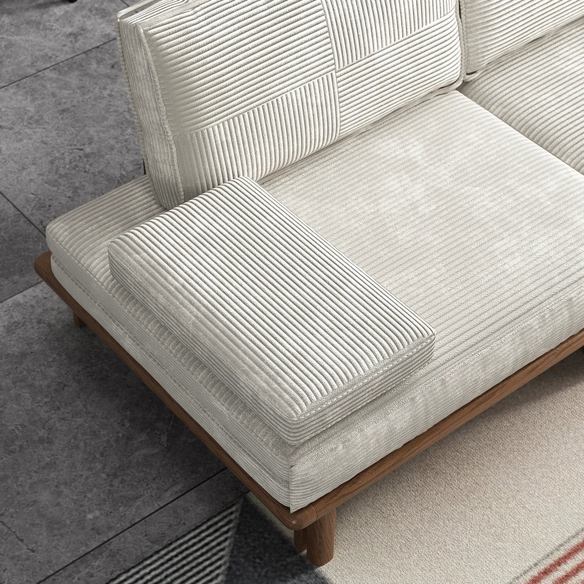 Close-up of the off-white corduroy cushions and wood frame