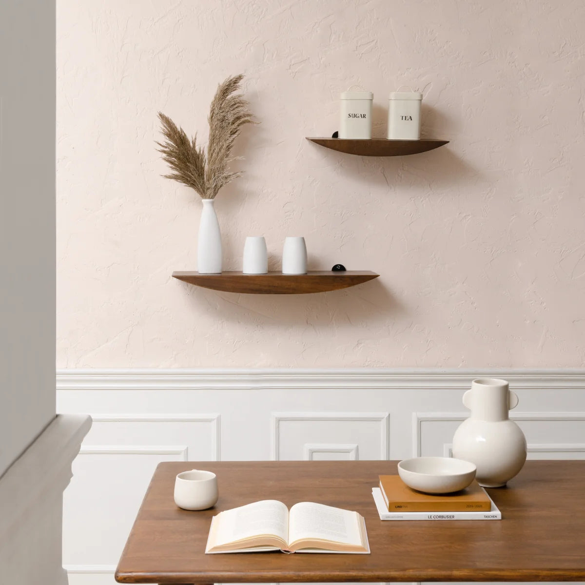 Oiva shelves above a wooden desk