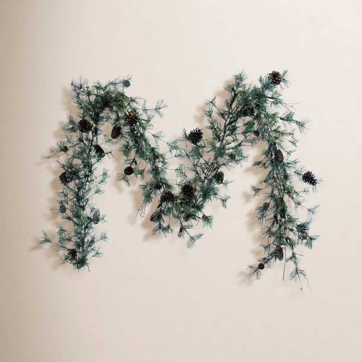 Dakota pine garland on a warm wall