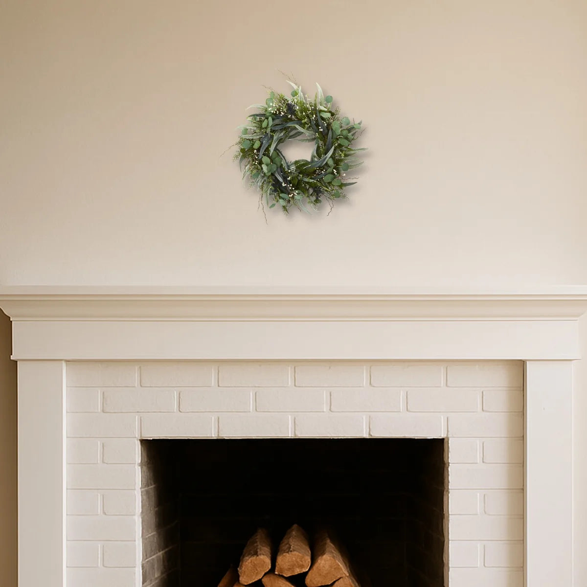 Eucalyptus wreath above a white fireplace