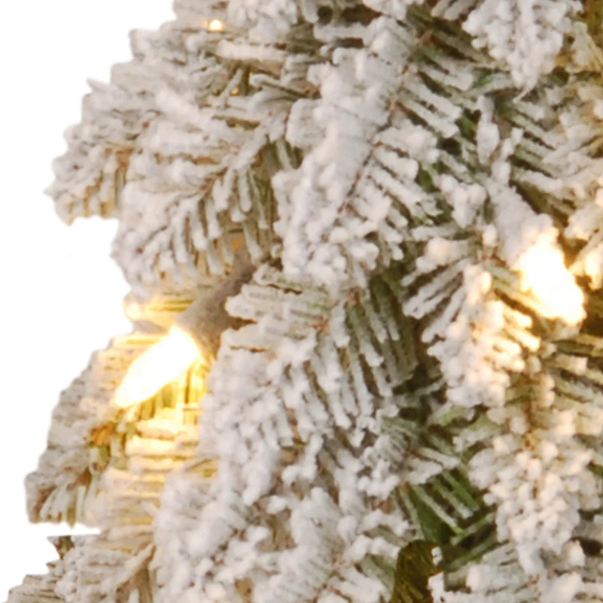 Flocked branches and lights close-up